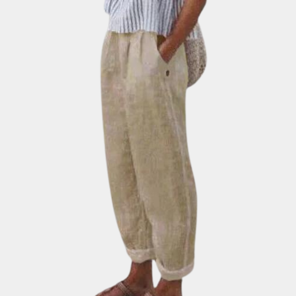 Elegante damebukser med høj talje, lige ben, elastisk linning og praktiske lommer, set forfra.