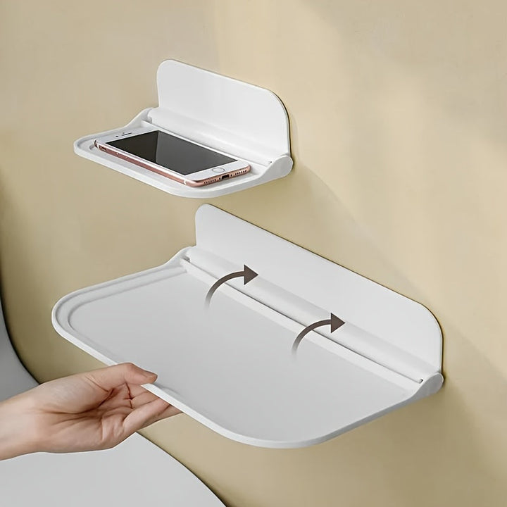 Foldbar væghylde i minimalistisk design, ingen boring nødvendig, perfekt til badeværelse og køkken, pladsbesparende.