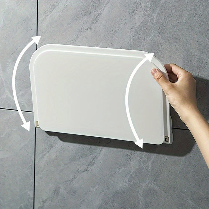 Foldbar væghylde i minimalistisk design, ingen boring nødvendig, perfekt til badeværelse og køkken, pladsbesparende.