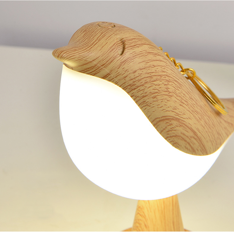 Genopladelig fugleformet natlampe i Ahorn, marmor eller rød med LED belysning, perfekt til stilfuld boligindretning.