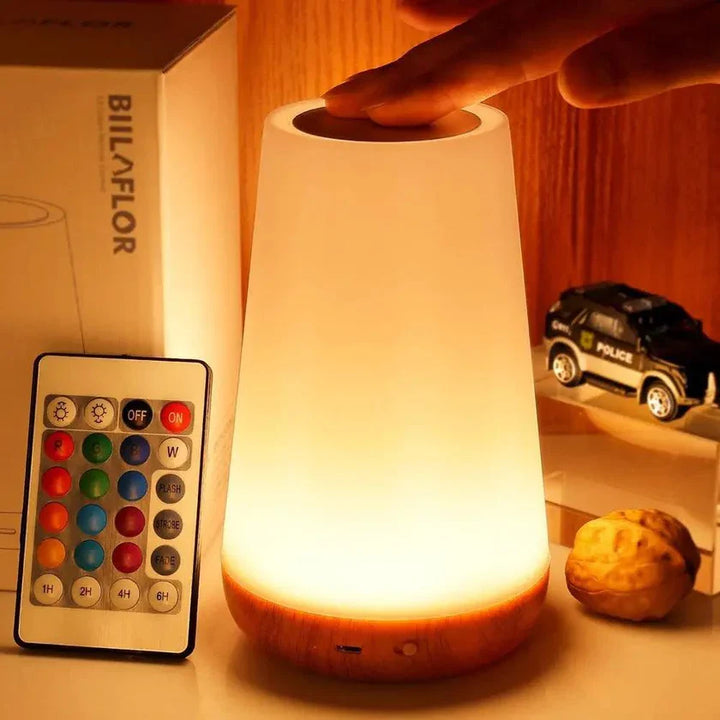 "Genopladelig touch-kontrolleret bordlampe med moderne design, skiftende lysfarver og kompakt bærbarhed."