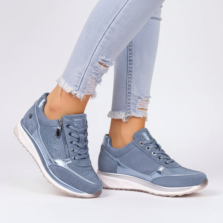 Grå ortopædiske dame sneakers med justerbar pasform, ideelle for optimal fodstøtte.