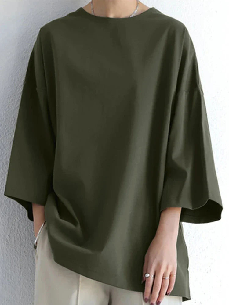 Løs damebluse med lange ærmer og rund hals for afslappet hverdagskomfort.
