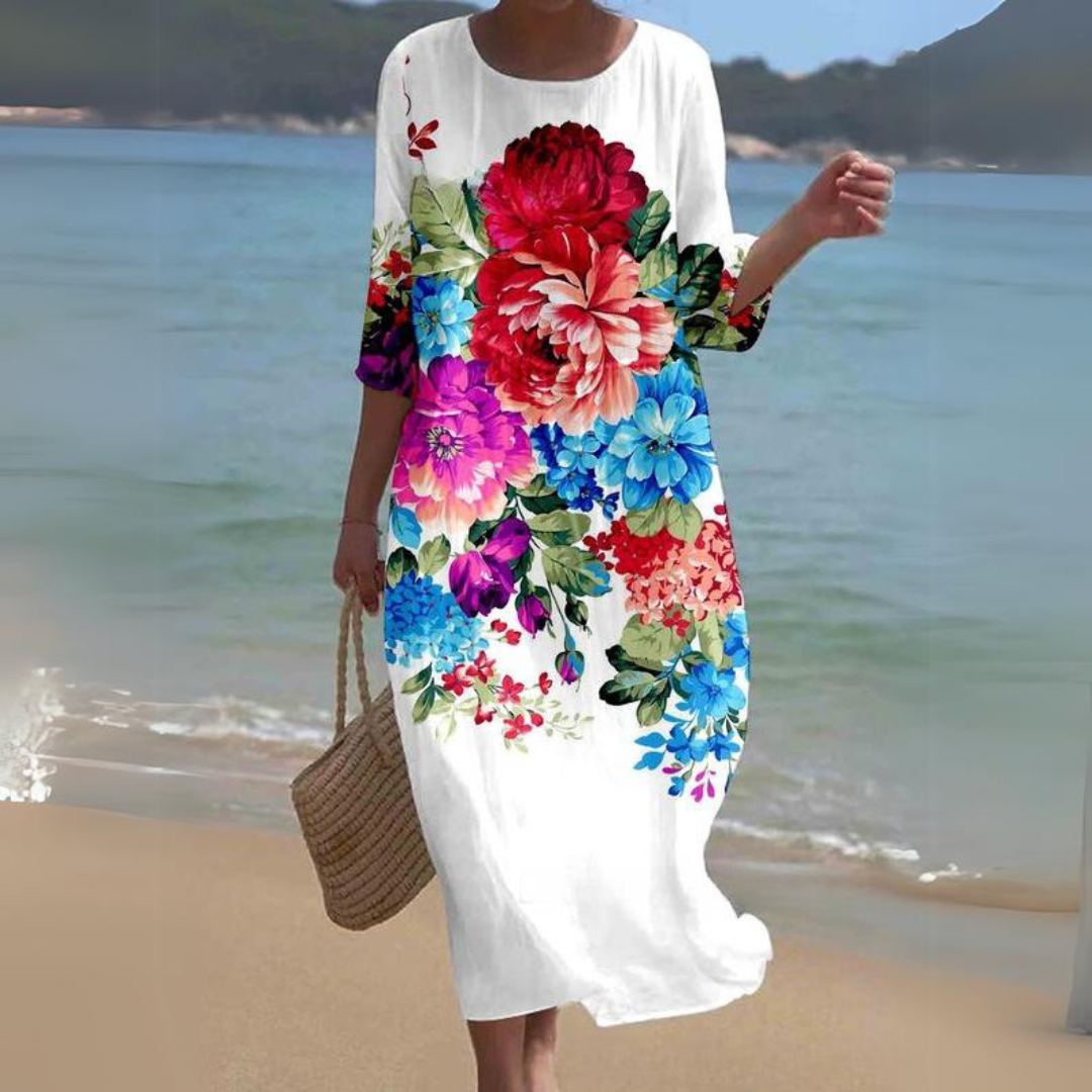 Elegant blomstret midi kjole med 3/4 ærmer og rund hals, perfekt til forår og sommer, alsidigt og feminint design.