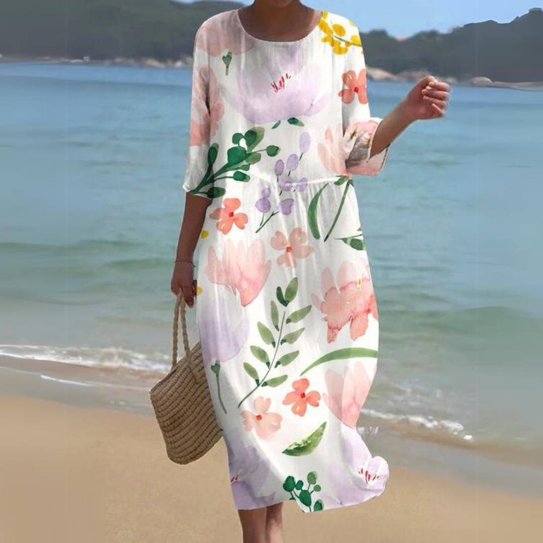 Elegant blomstret midi kjole med 3/4 ærmer og rund hals, perfekt til forår og sommer, alsidigt og feminint design.