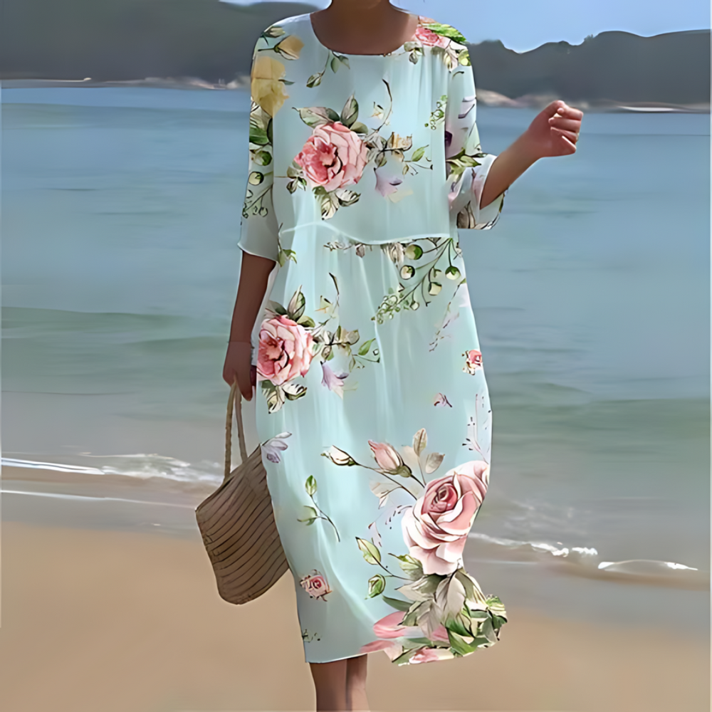 Elegant blomstret midi kjole med 3/4 ærmer og rund hals, perfekt til forår og sommer, alsidigt og feminint design.