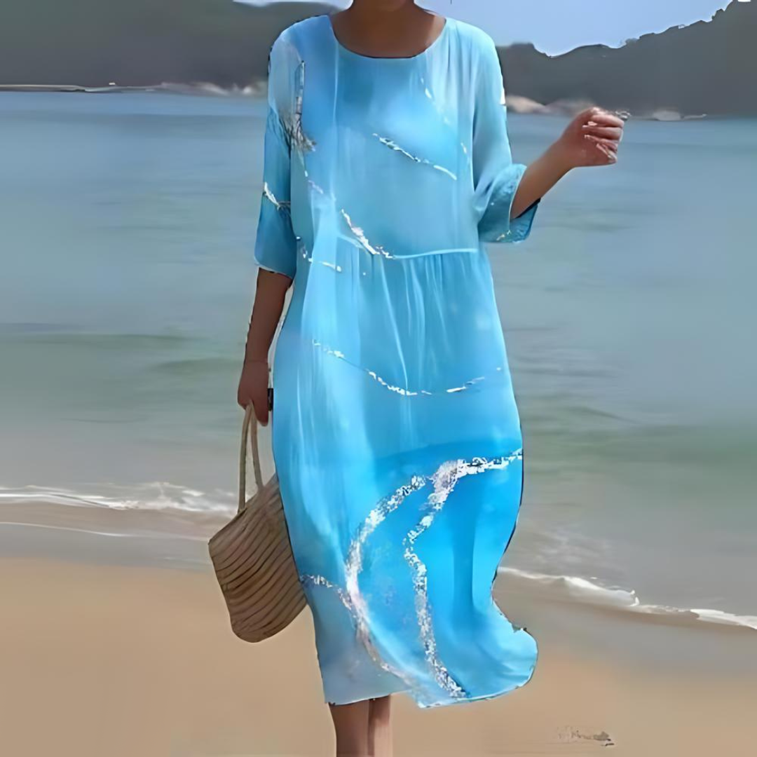 Elegant blomstret midi kjole med 3/4 ærmer og rund hals, perfekt til forår og sommer, alsidigt og feminint design.