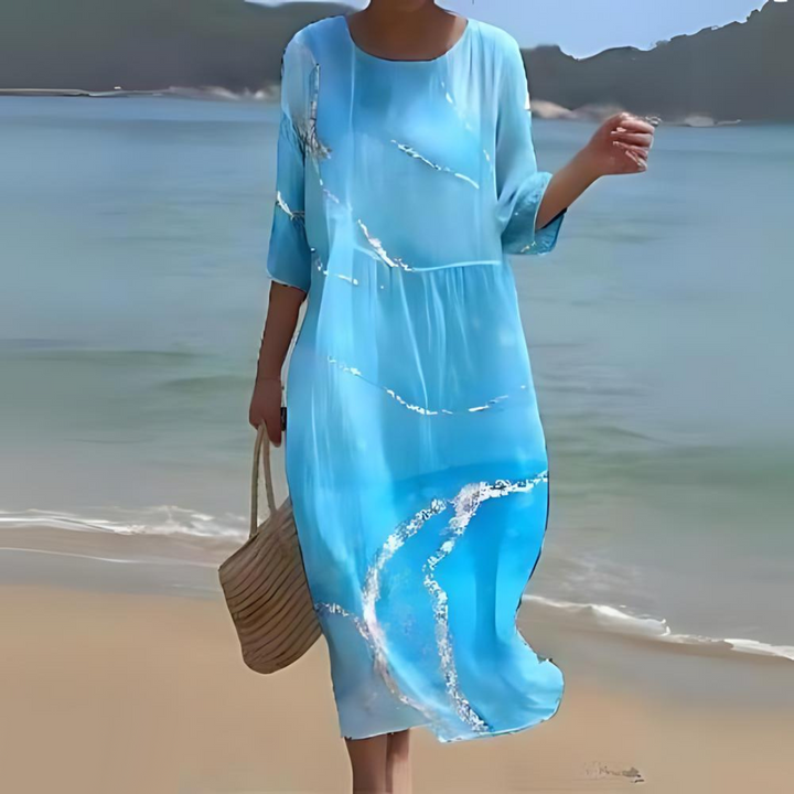 Elegant blomstret midi kjole med 3/4 ærmer og rund hals, perfekt til forår og sommer, alsidigt og feminint design.
