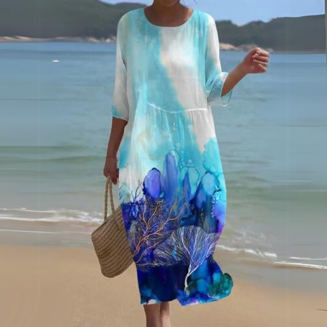 Elegant blomstret midi kjole med 3/4 ærmer og rund hals, perfekt til forår og sommer, alsidigt og feminint design.