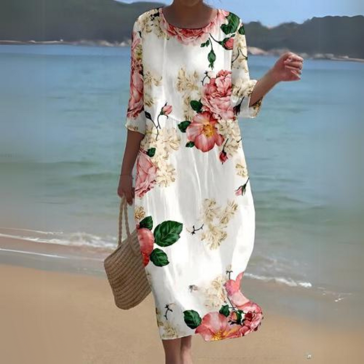 Elegant blomstret midi kjole med 3/4 ærmer og rund hals, perfekt til forår og sommer, alsidigt og feminint design.
