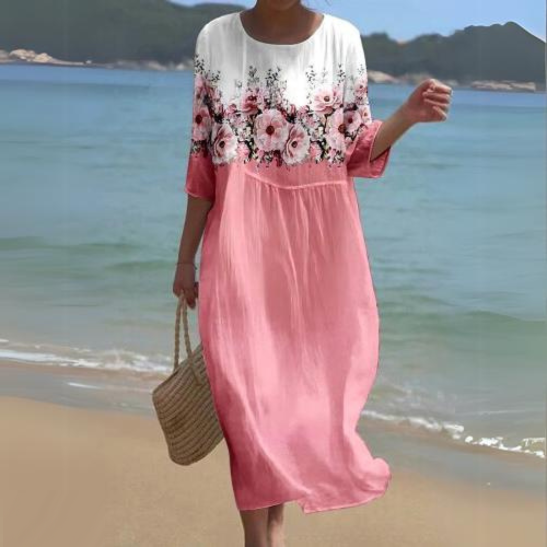 Elegant blomstret midi kjole med 3/4 ærmer og rund hals, perfekt til forår og sommer, alsidigt og feminint design.