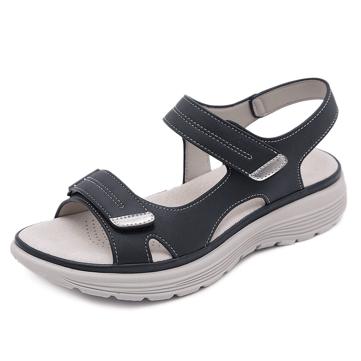"Ortopædiske sandaler med ergonomisk design, bred tåboks og svangstøtte, perfektioneret for maksimal komfort og stabilitet."