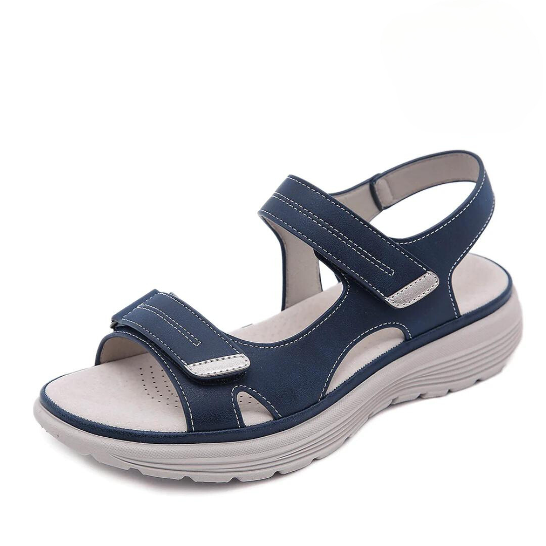 "Ortopædiske sandaler med ergonomisk design, bred tåboks og svangstøtte, perfektioneret for maksimal komfort og stabilitet."