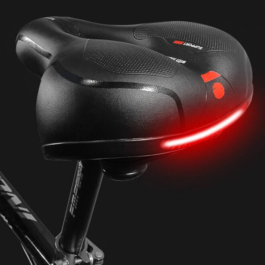 "Sort ergonomisk cykelsadel med hukommelsesskum og refleksstriber, ideel til lange cykelture for optimal komfort."