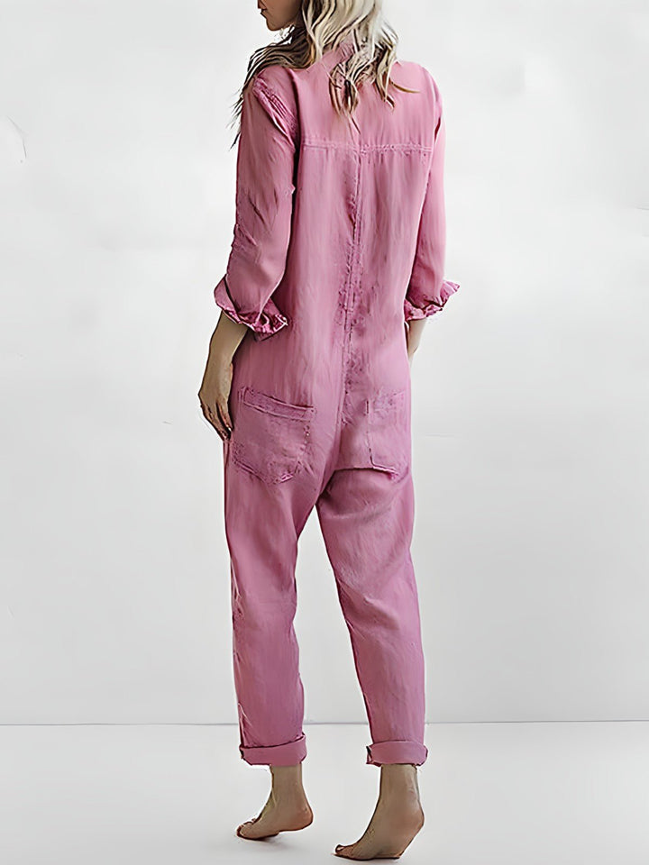 Stilfuld blå og grøn Kaya jumpsuit til kvinder, elegant design med lange ærmer og komfortabel pasform til enhver lejlighed.