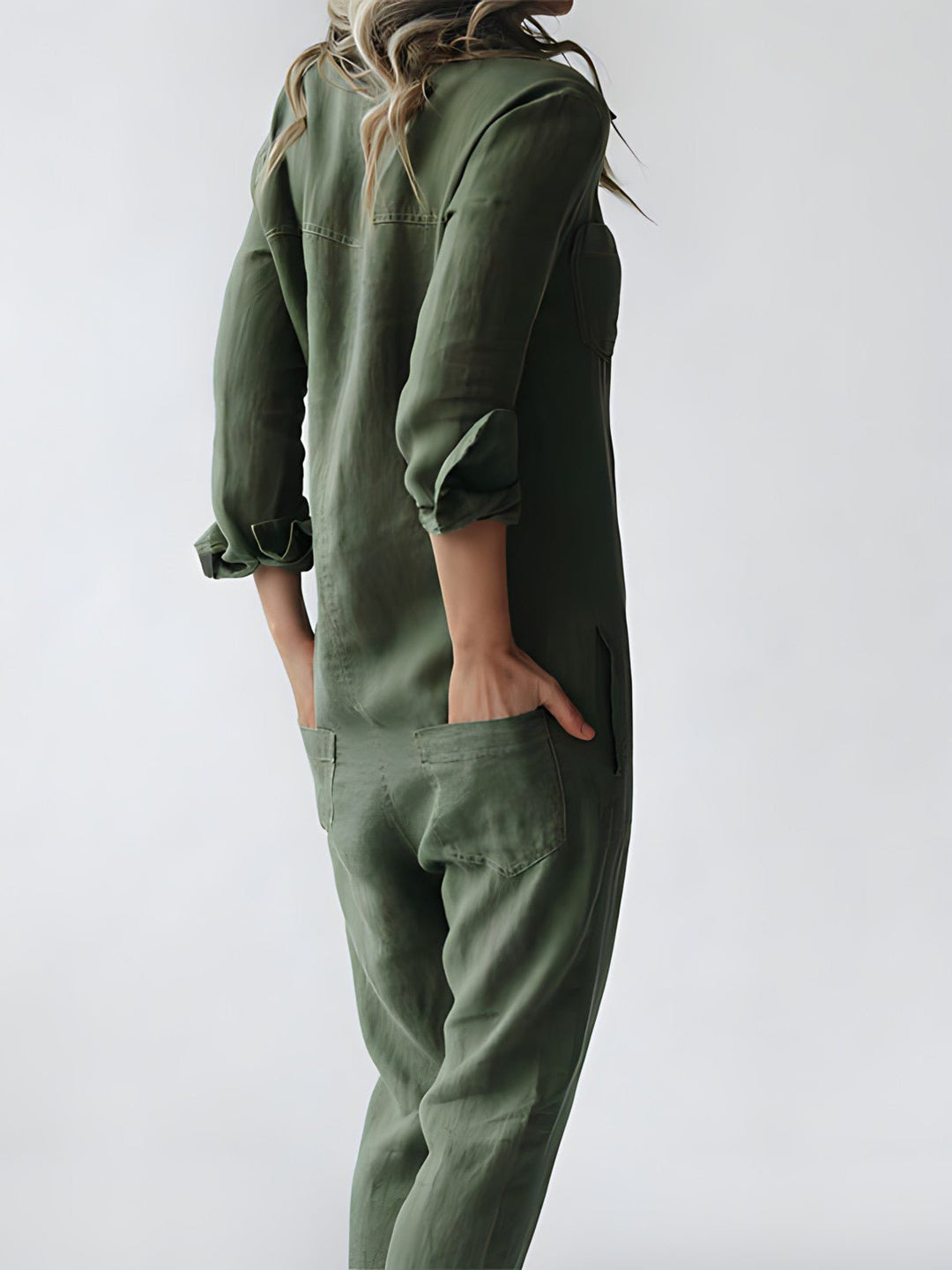 Stilfuld blå og grøn Kaya jumpsuit til kvinder, elegant design med lange ærmer og komfortabel pasform til enhver lejlighed.