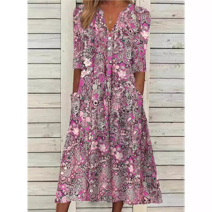 Stilfuld blomstret skjortekjole til kvinder, med knaplukning og elegant pasform, perfekt for komfortabel og raffineret stil.