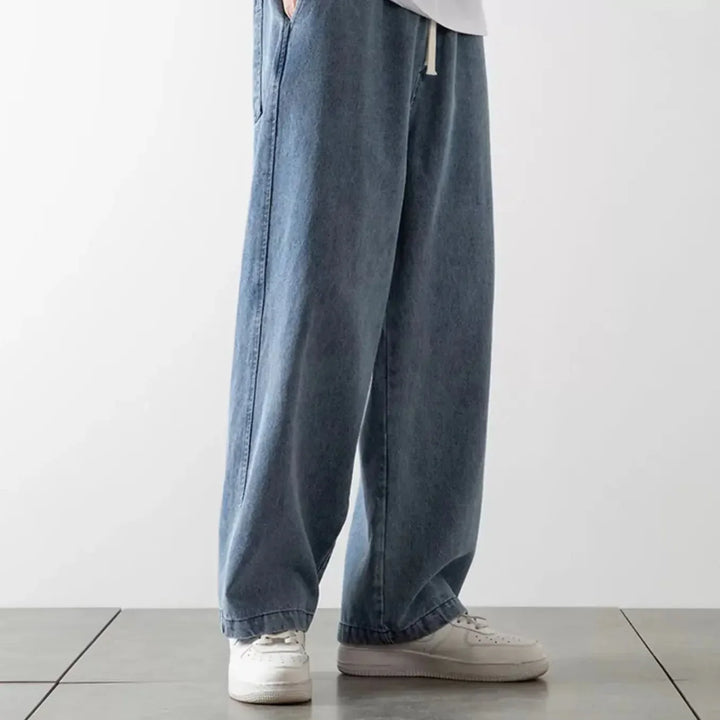 Komfortable unisex baggy jeans med afslappet pasform og fleksibel elastisk talje.