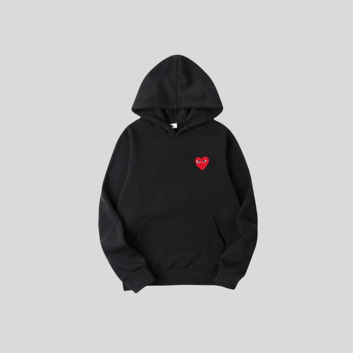 Unisex hættetrøje med unikt hjerte detalje. Blød og komfortabel overdel til moderne casual og streetwear mode.