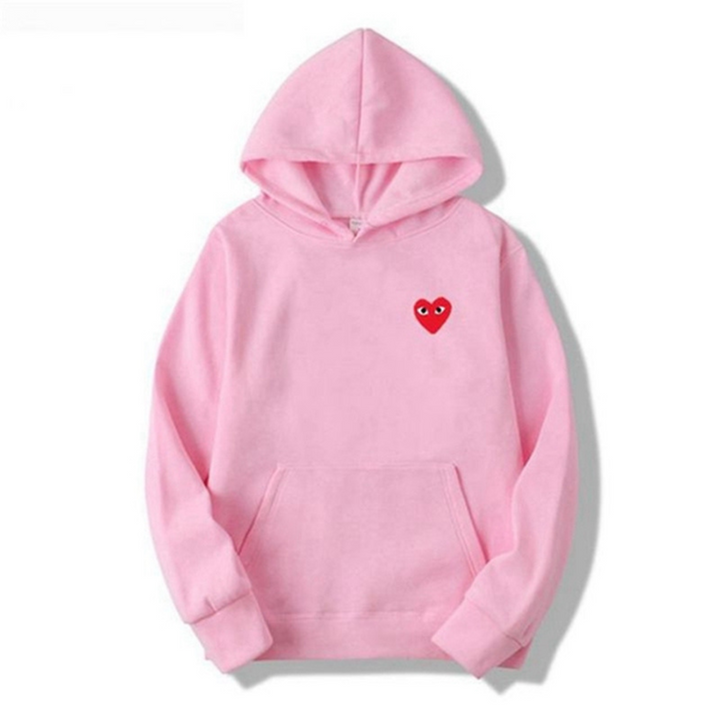 Unisex hættetrøje med unikt hjerte detalje, en alsidig og komfortabel overdel til casual og streetwear mode.