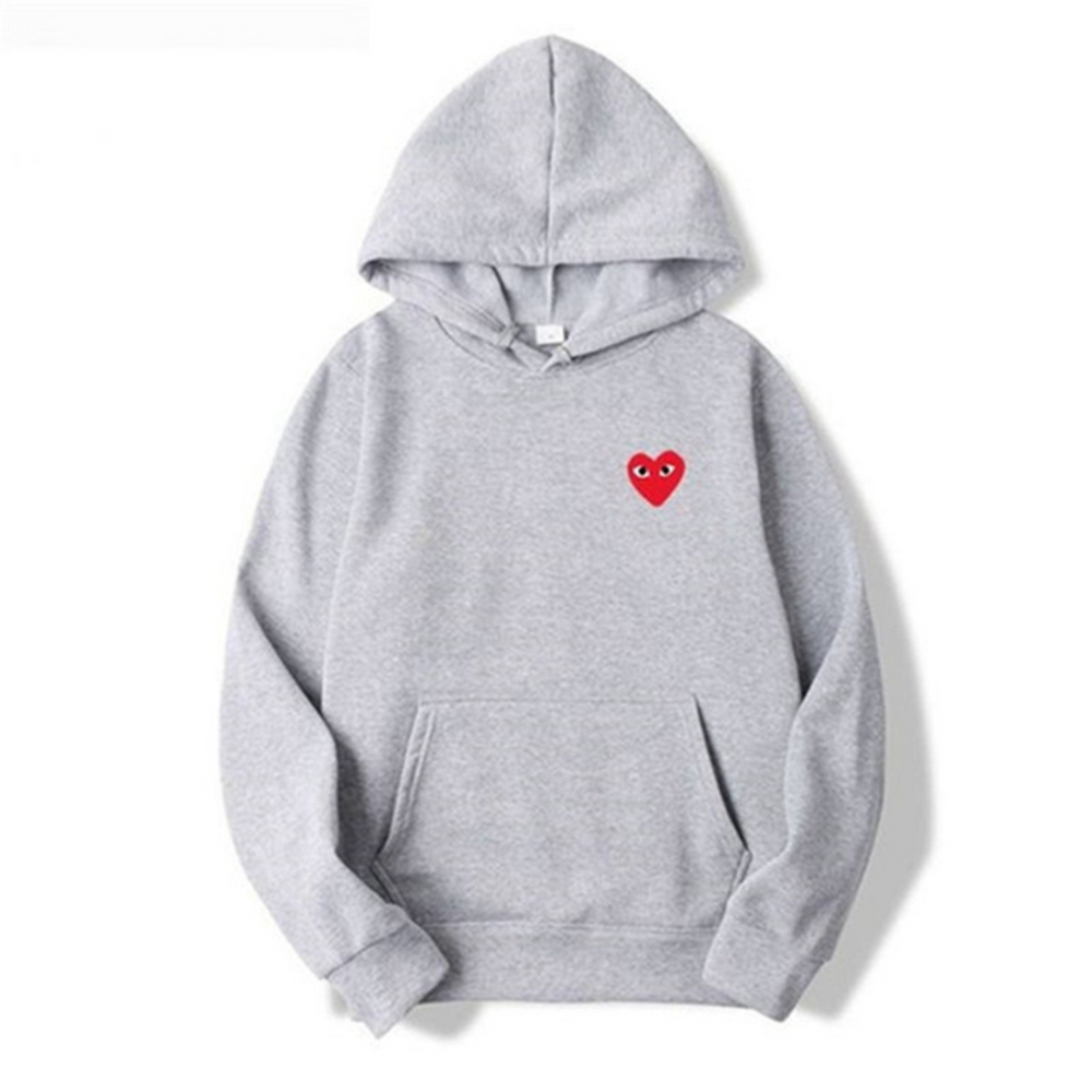 Komfortabel unisex hoodie med stilfuldt hjerte design. Ideel overdel til afslappet mode og hverdagens streetwear.