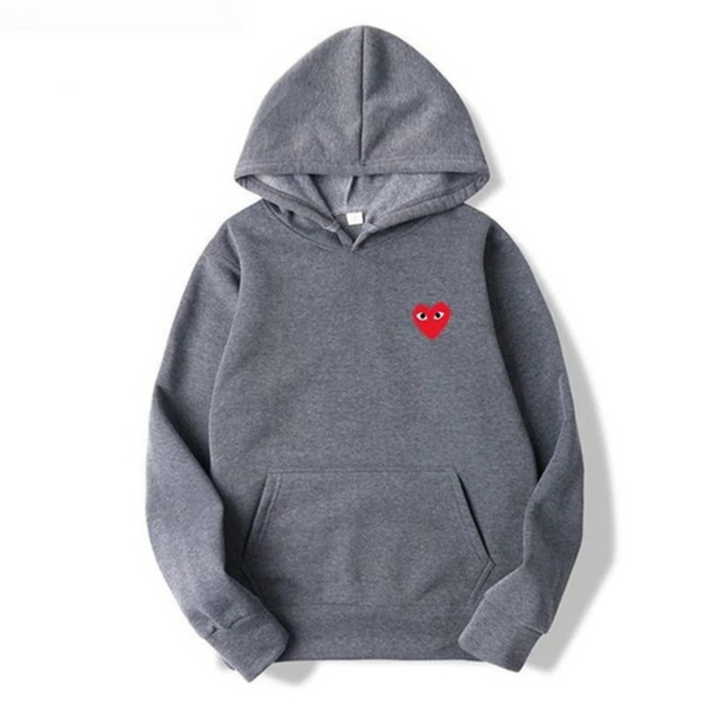 Enkel og stilfuld unisex hættetrøje med et charmerende hjerte detalje. En casual og komfortabel overdel.