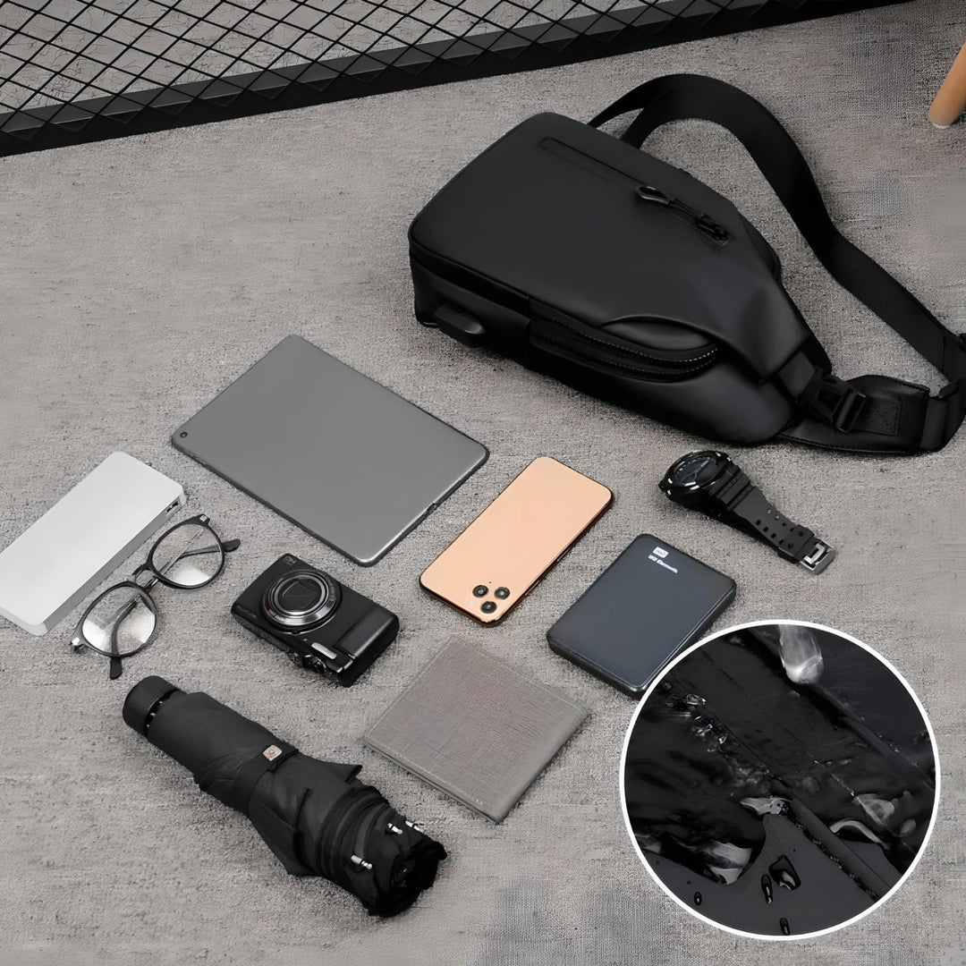 Unisex skuldertaske med god organisering, vandtæt design og USB-opladning, blå.