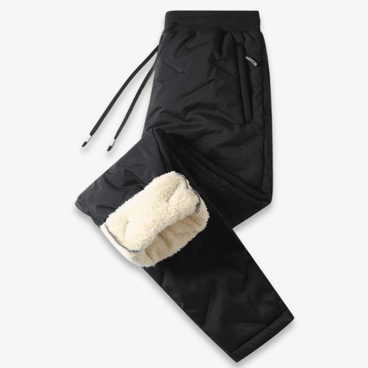 Vejrbestandige unisex termobukser til ekstrem kulde, isoleret foring, elastisk talje, vinterbrug, gråt design.